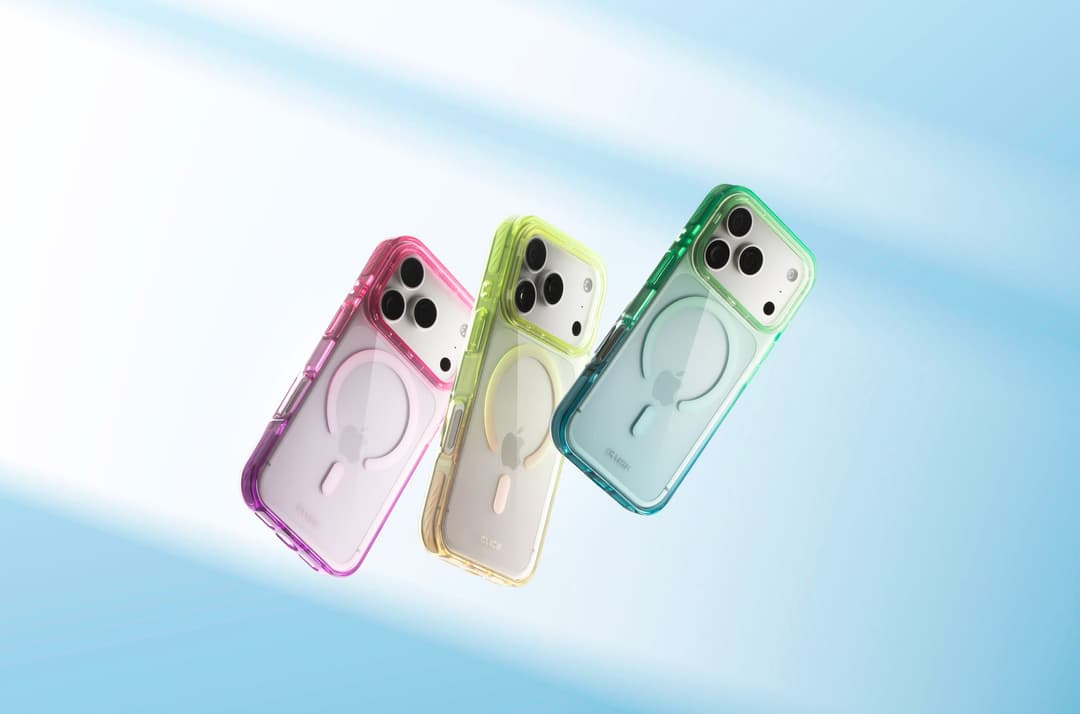 Three CLICK Clear Ombre MagSafe cases floating against a soft blue backdrop — pink-purple, yellow, and green-teal gradients, rings visible